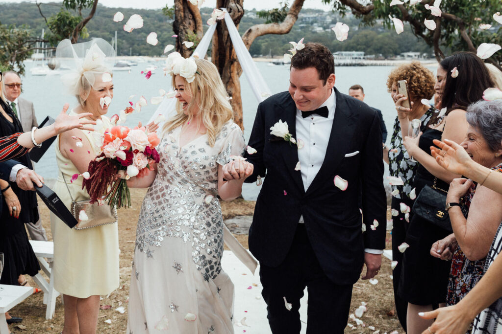 bride and groom walking down aisle at balmoral beach wedding