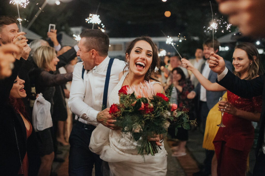 bride and groom sparkler exit boat house palm beach wedding