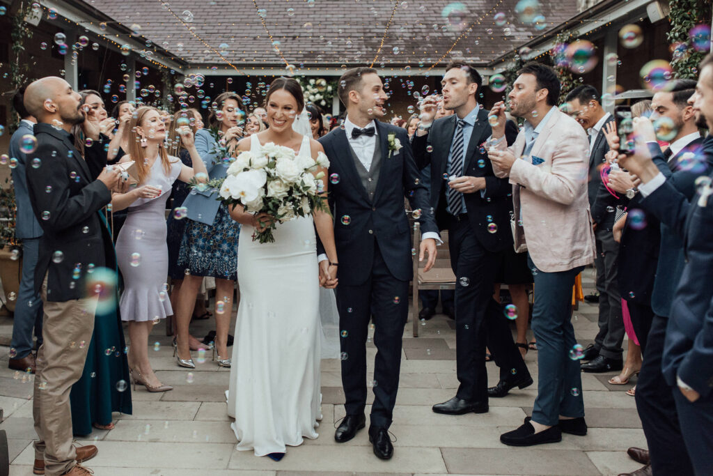 bride and groom walking down aisle at gunner barracks