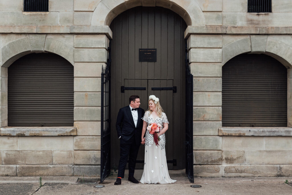 groom and bride posing at ripples chowder bay wedding