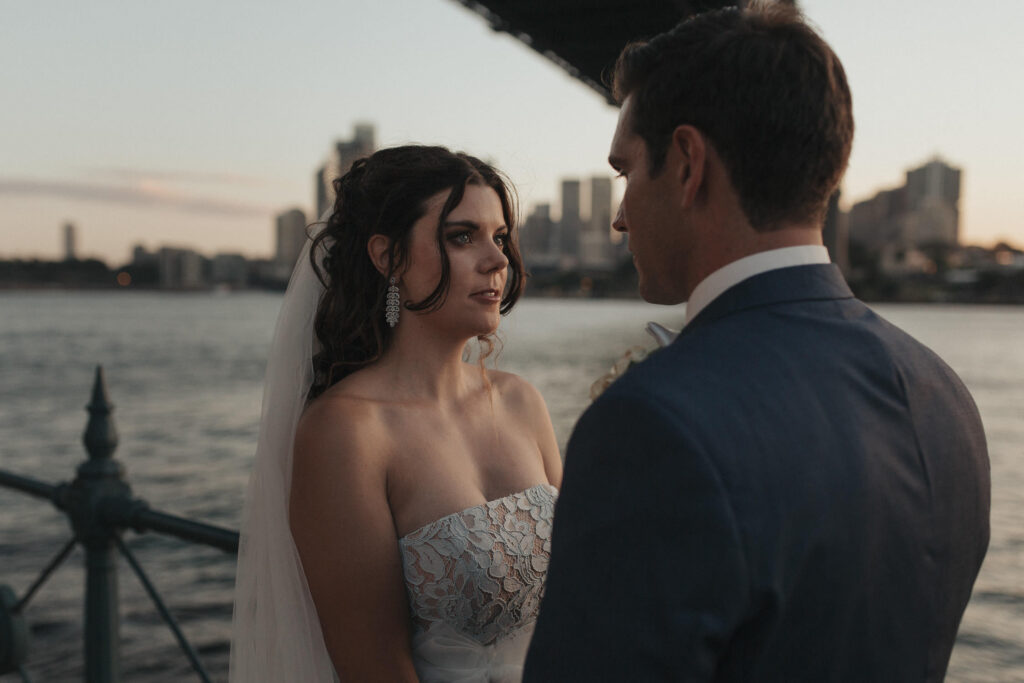 bride and groom portrait under sydney harbour bridge