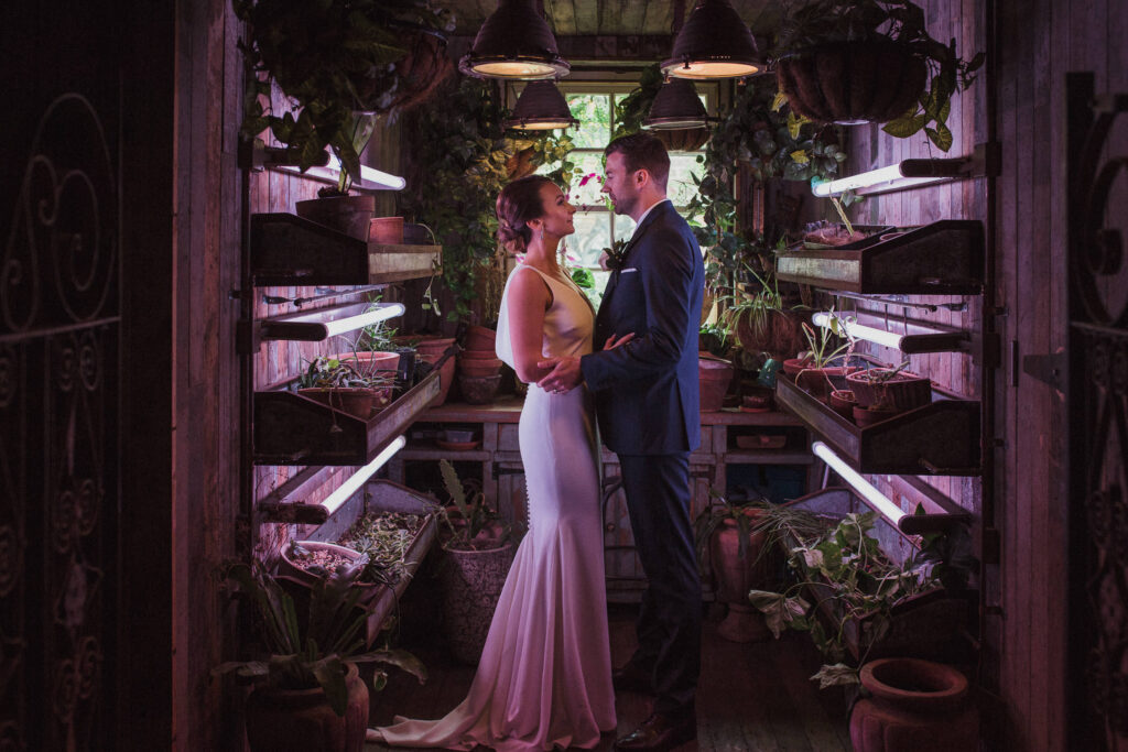 bride and groom posing at the grounds wedding