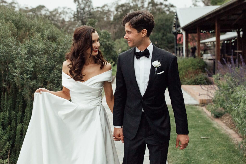 bride and groom smiling at each other in byron bay