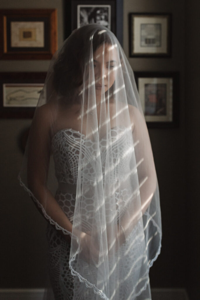 bride wearing veil in sunlight