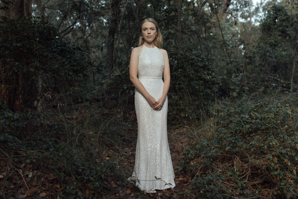 bride standing in rainforest