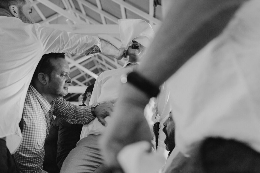 groom on chair at sydney jewish wedding