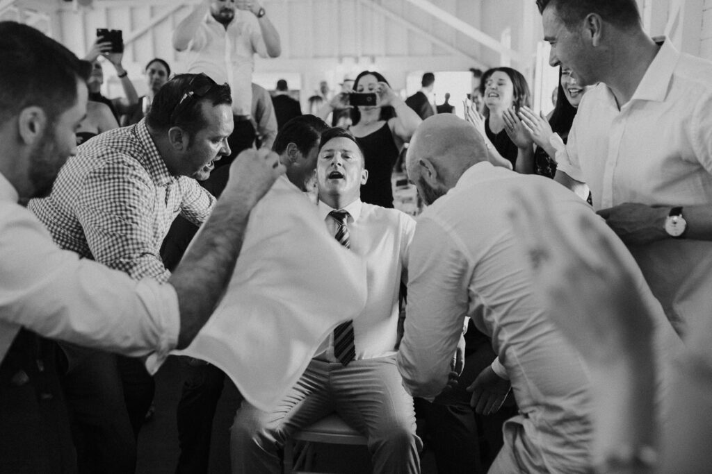 man sitting on chair at sydney jewish wedding