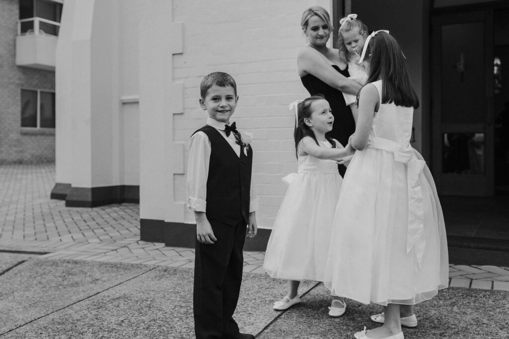 young boy smiling at sydney wedding