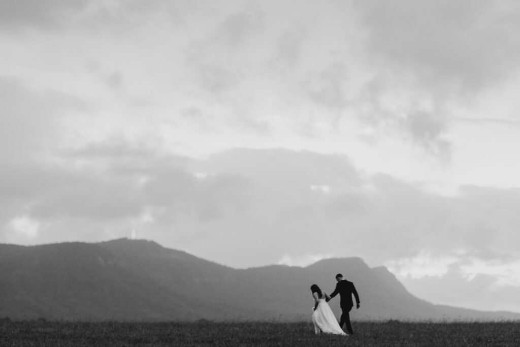 bride and groom walking in new zealand
