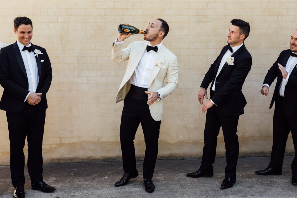 groom wearing white tuxedo bowral wedding